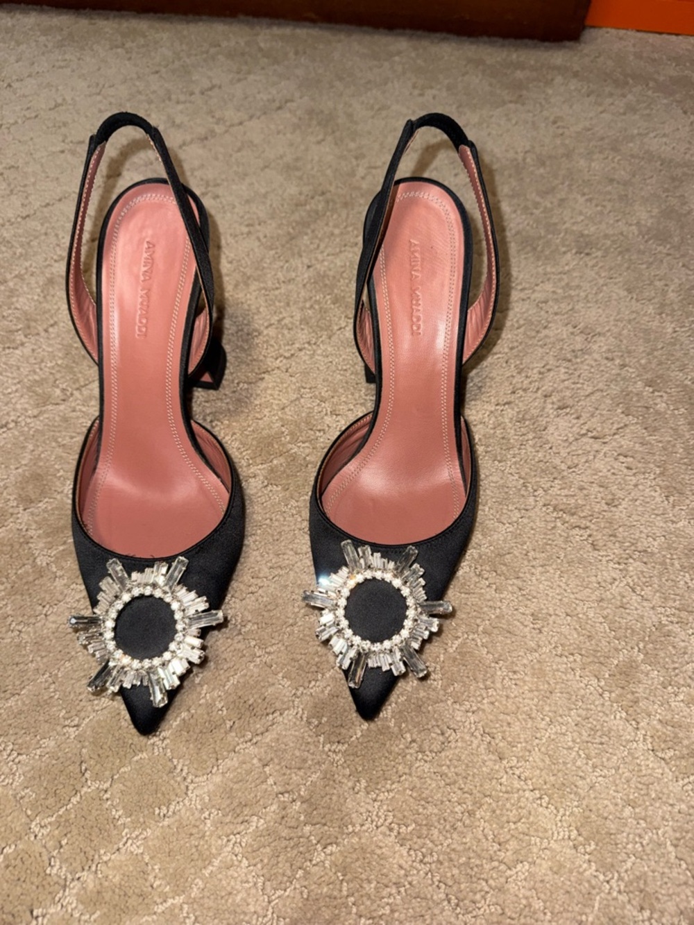 Amina Muaddi Black Slingback Pumps with Crystal Sunburst